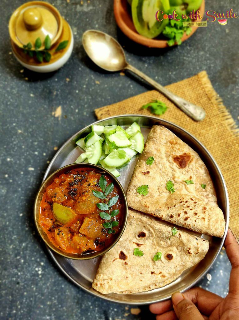 Green Tomato Curry / Kayi Tomato Gojju is an easy and tasty side dish with a perfect blend of spiciness , tartness and a tinge of sweetness